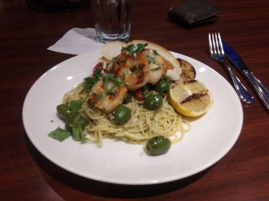 Shrimp fresca with green olives, charred tomato, grilled shrimp and lemon, sprinkled with park and cilantro--very delicious!