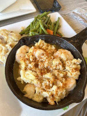 Outer Banks seafood and crab, which has shrimp and crab meat and is served with mashed potatoes and vegetables