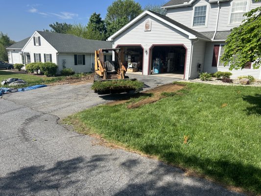 Cutting out grass to widen driveway