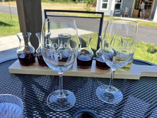 The flight, in bottom to top order on the printed menu. Tasting room is in the background.