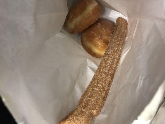 Churro(was kind hard) strawberry filled and Bavarian cream filled donut