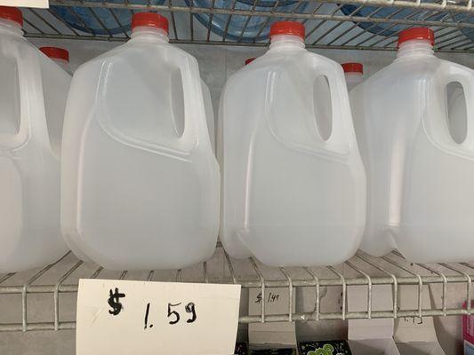 Empty gallon water jugs for sale.