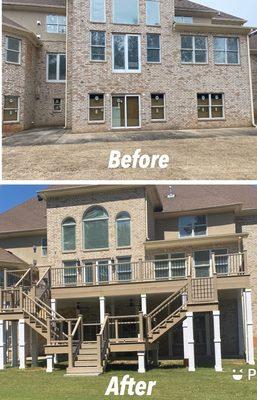 Deck with double stair case using Trex decking and Handrails with black round balusters.