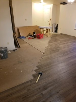 Home stretch of a Vinyl Plank floor install.