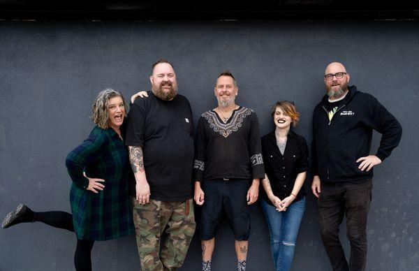 Welcome to the Daddy's team. On each end are our owners Tim and Terri. 
 
 Starting from the left:
 Our barbers Brian, Wade, and Courtney.