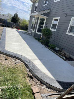 Charcoal Roman slate stamped perimeter patio