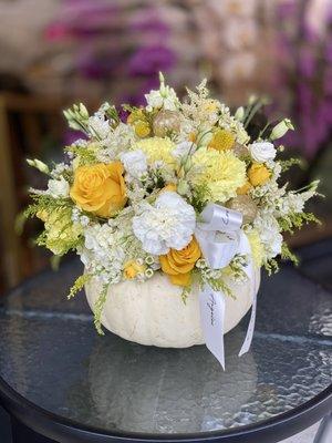 This beautiful  pumpkin arrangement is a great accent to any table in a home. This would for sure bring a smile to that special someone.