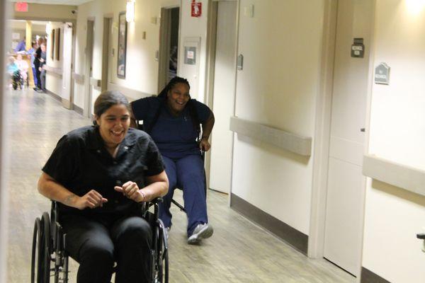 Respiratory and Nursing Center residents love to see staff compete! Here's our annual wheelchair race; the winner takes home a turkey!