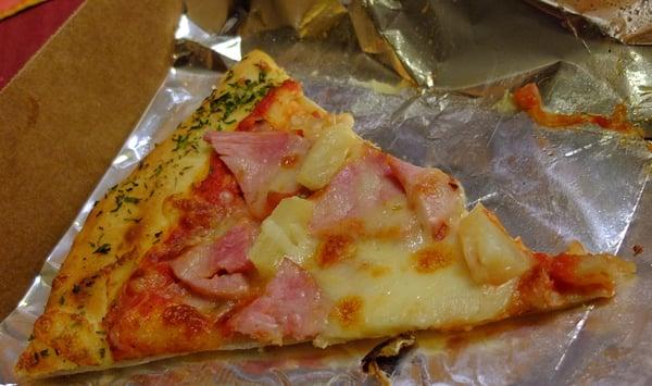 Pizza with Canadian bacon and pineapple. I'm not sure what the spice is that they put on the crust, but it was nice, too.