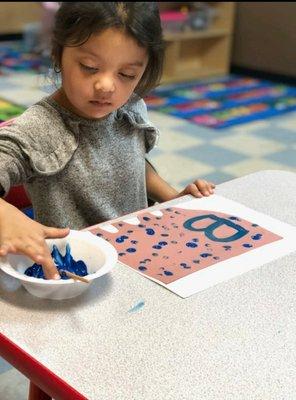 We learn our letters with some messy fun!