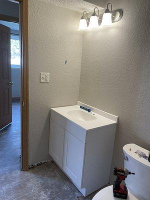 Bathroom Vanity and light fixture install (during)