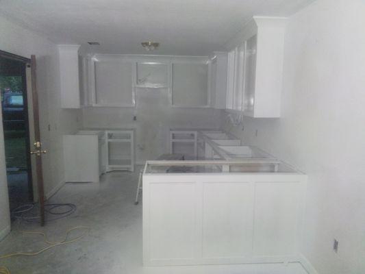 Home kitchen remodeling,  sheet rock and paint . Cabinets built to your needs and flooring