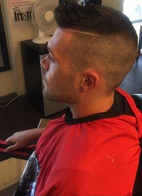 nice low side fade with a deep side part and moosed top