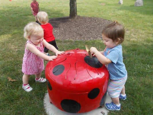 Children play in a natural environment in our musical garden.