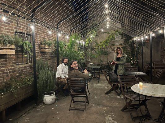 NYC writers at Dada Literary Café (Constantine Jones, Danielle Blau, Mani Tehranchi) taking a break at Dada's backyard