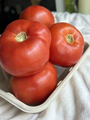 The tomatoes are incredible! $10 for a basket and there are around six big tomatoes in a basket... They are juicy and delicious