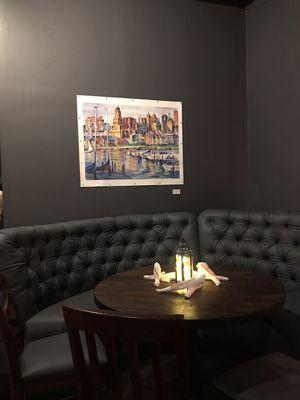 Cozy booth seating with local art