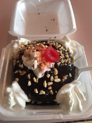 Hot fudge cake (2 slices of cake with soft serve in the middle with hot fudge, whipped cream, nuts, and cherry).