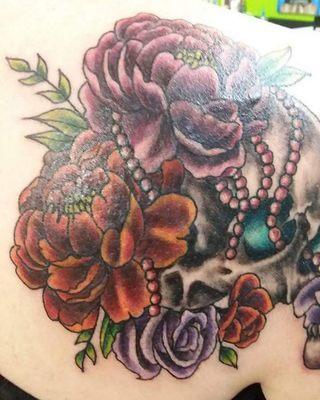 Skull and flowers cover up by April