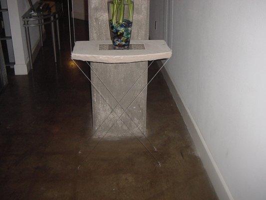 Handmade stone table suspended by cables