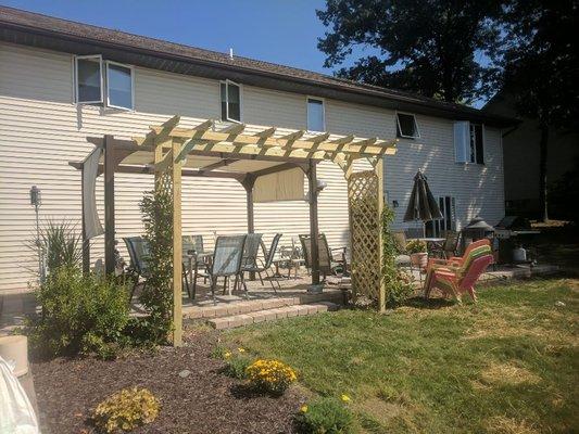 A custom built trellis and patio in Archbald, PA