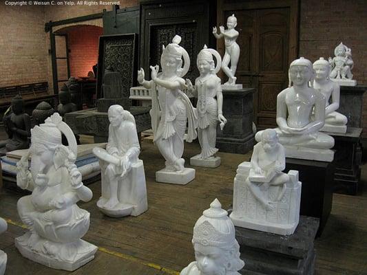 Grouping of polished stone Buddhist statues.