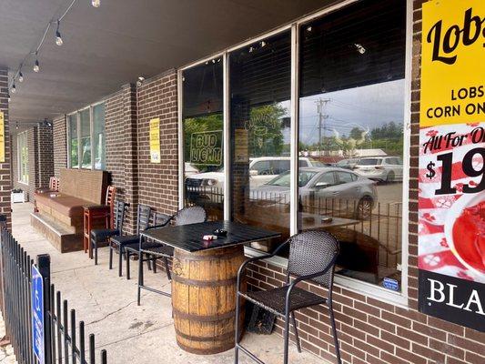 Front patio more outdoor seating to right