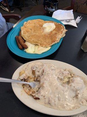 Massive pancakes with fried eggs and sausage. One biscuit with sausage gravy and home fried potatoes. Just delicious