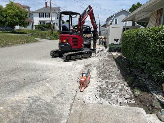 Tearing out concrete sidewalks