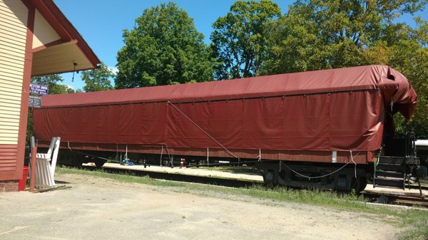 Covered train car.