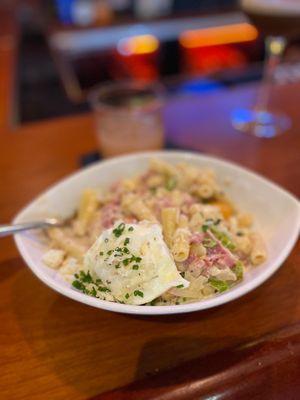 Hangover pasta (creamy pasta with ham, egg and peas with a poached egg on top)