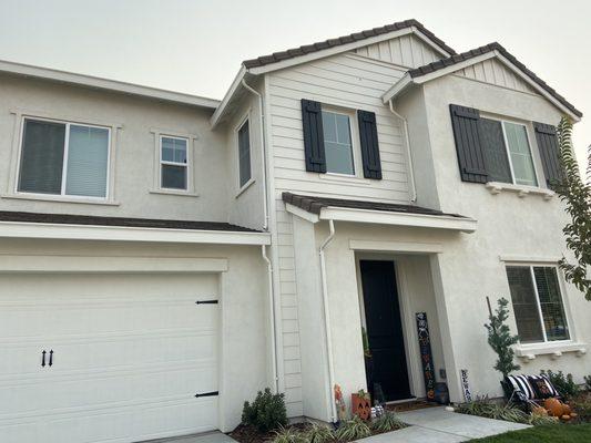 Finished product. Shutters, front door, and garage painted.