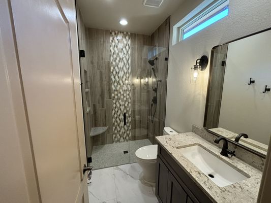 Newly remodeled bathroom: zero-entry shower, modern fixtures, and a complete update for a fresh, contemporary look