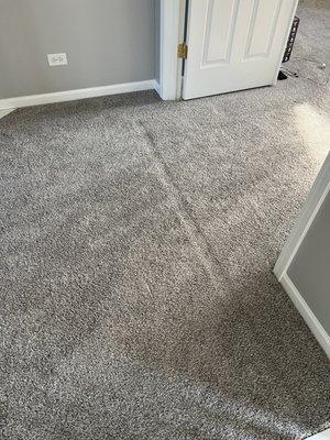 Entryway to master bedroom.  Defective carpet installed.