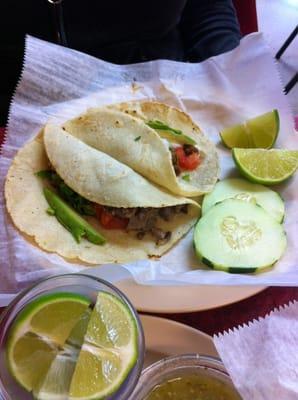 Pork and tongue tacos on homemade corn tortillas