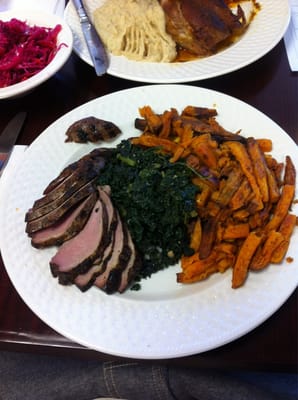 Grilled duck, kale, akin sweet potato fries