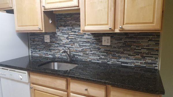 New granite countertop and backsplash installation