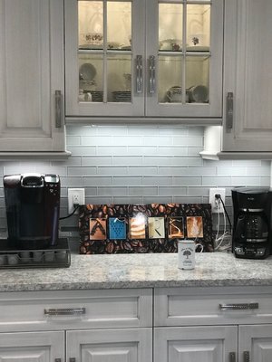 Transitional Cabinets in Arctic White Nickel. LG Everest Quartz Counters, Trevi Pull Polished Nickel Handle Pulls. Main Splash is Element Cl