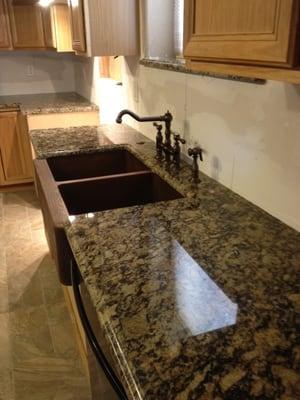 Portofino Granite with Farm House Style Copper Sink.