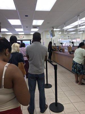 Inside the lines of Bank of America waiting to speak with the teller on a daily basis