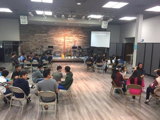 Friday Night Lighthouse Youth Fellowship from 7:30pm to 9:30pm. Here we have Jr High and High School students having small group time