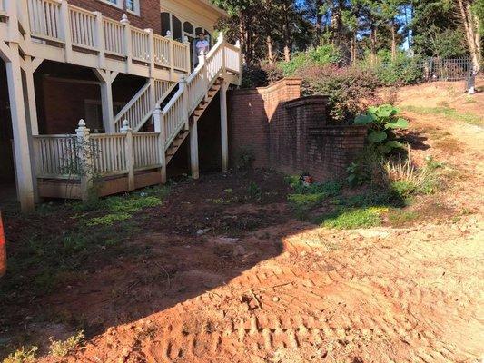 This was a very rough looking back yard! No ground cover, constant erosion. Outdated stair case.