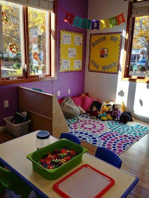 Children are always welcome to spend a quiet moment in our classroom Reading Area where they can snuggle with a stuffed animal and a book!