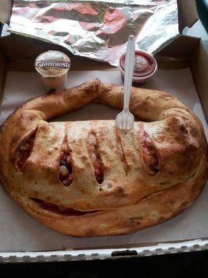 Calzone easily feeds two. The plastic fork is used to show scale.