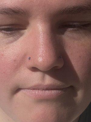 Paired nostril piercings with neometal opals