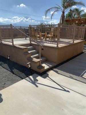 Custom raised seating area with concrete stairs/pad