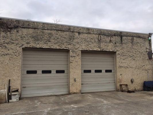 Four large bay doors that can accommodate small to medium size vehicles and trucks.