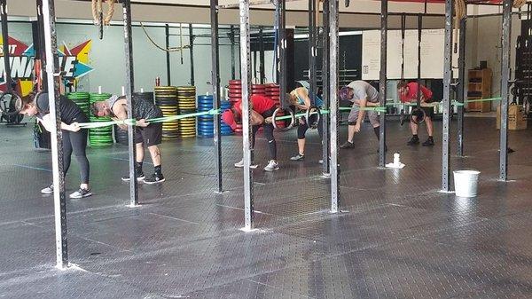 Here our members are conducting  warm-up and mobility of the shoulders. This is done daily here at CrossFit Pinnacle.