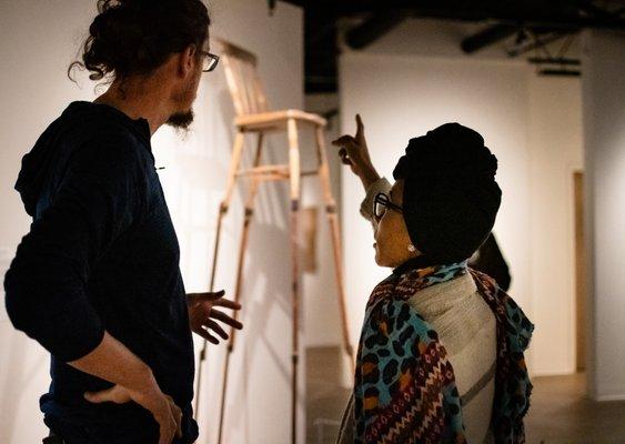 Visitors admiring artworks on view during "African Art Now," June 2019.