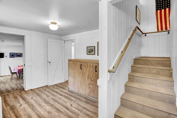 Side view of stairs and Murphy bed